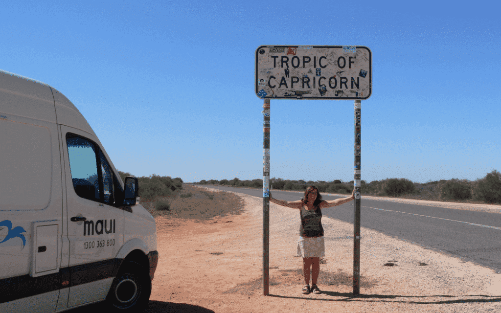 A girl standing at the tropic of Capricorn in Australia
