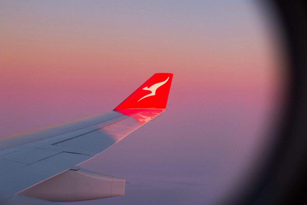 Ariel shot of a Qantas plane wing on a flight to Australia from the UK