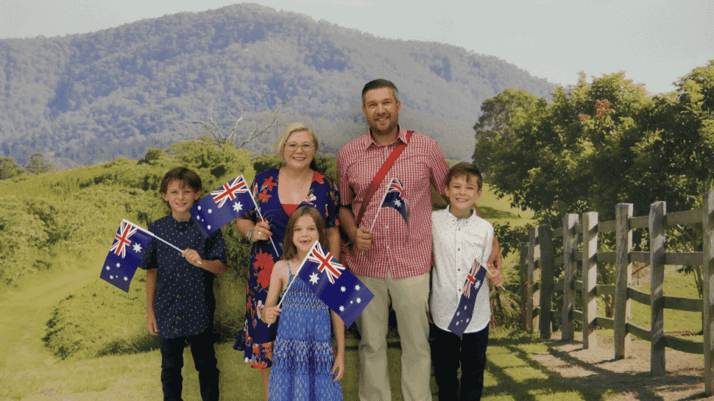 A family receiving their Australian citizenship certificates at an Australian citizenship ceremony