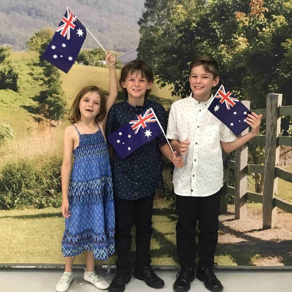 Kids receiving their Australian citizenship certificates at the Australian citizenship ceremony