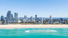 Image shows a Gold Coast beach and high rise towers