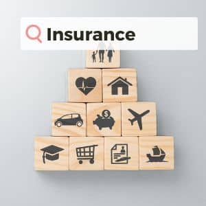 A picture of a stack of building blocks with different icons on them and the word 'insurance' over the top