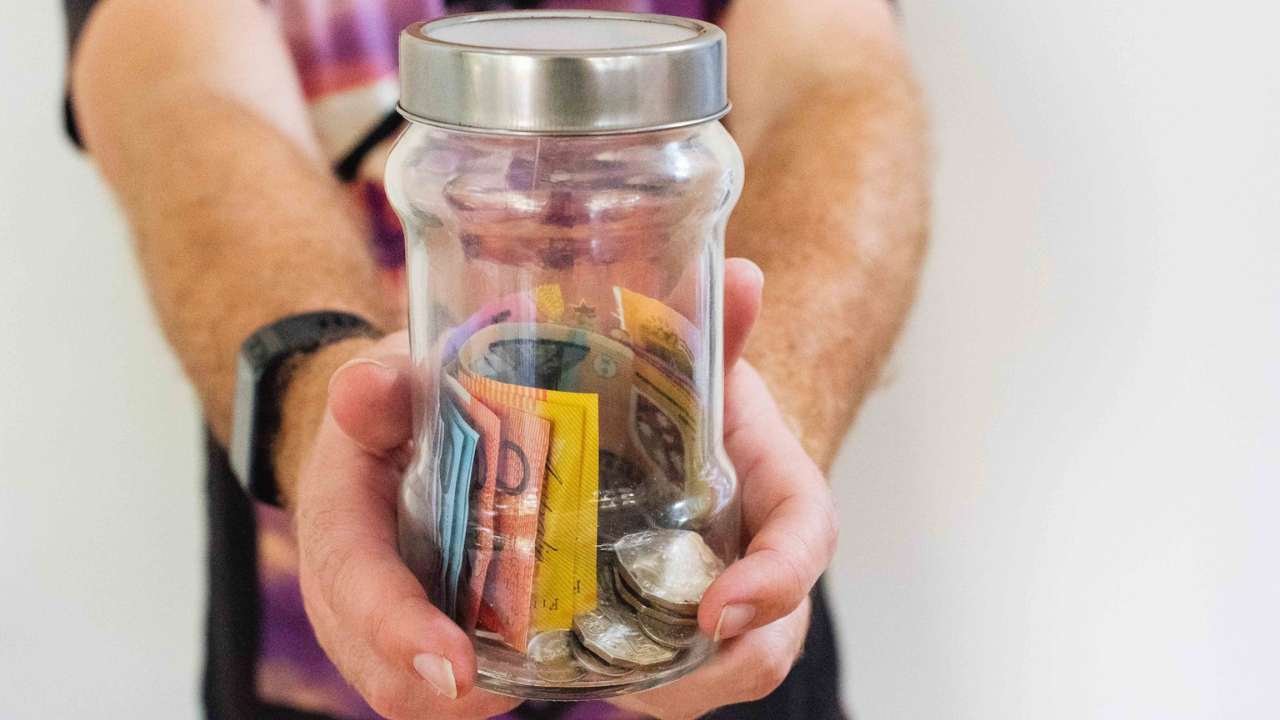 A jar of money saved after doing a bills comparison 