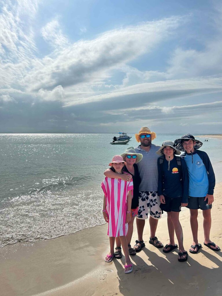 A family on a beach at Great Keppel Island 